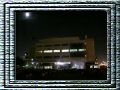 A full moon shines over a full crowd.